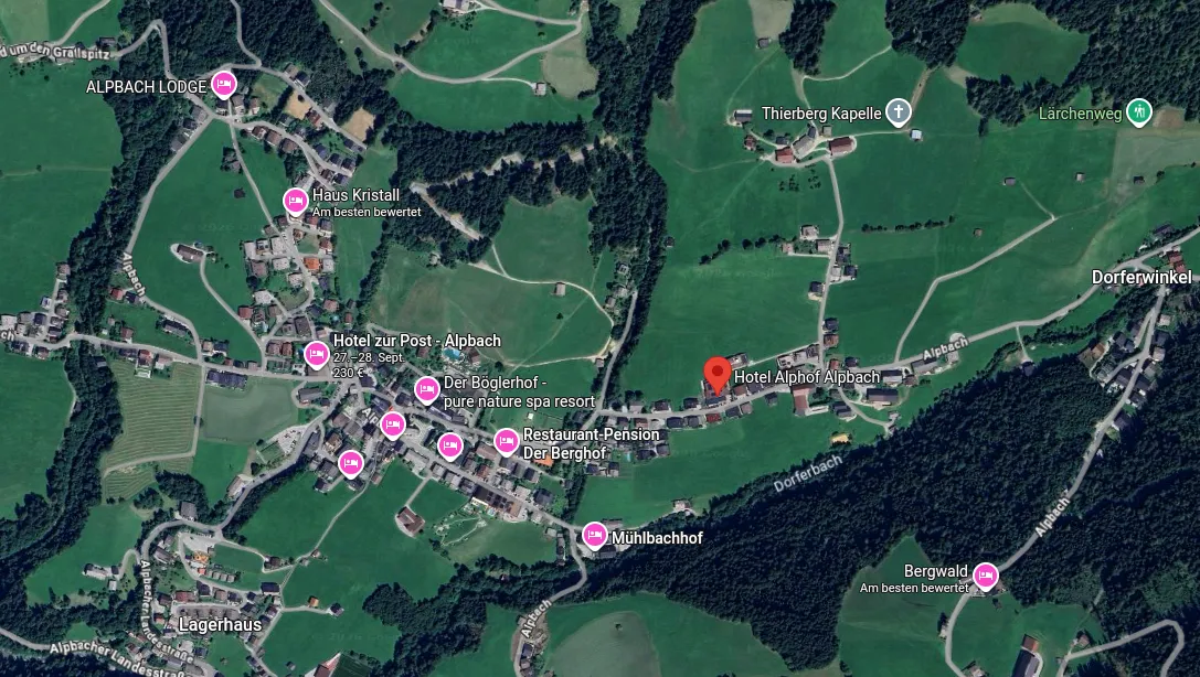 Google Maps satellite view of Alpbach village with a red pin on Hotel Alphof Alpbach, surrounded by other hotels such as Hotel zur Post and Der Böglerhof