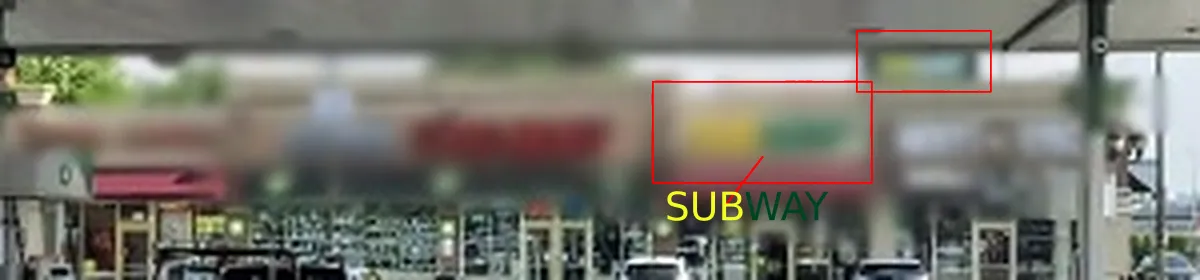 A zoomed crop of the blurred strip mall: a red smear on the left; one box marks a yellow patch next to a green one on the storefront, a second box a smaller yellow-green sign higher up, labelled SUBWAY in yellow and green