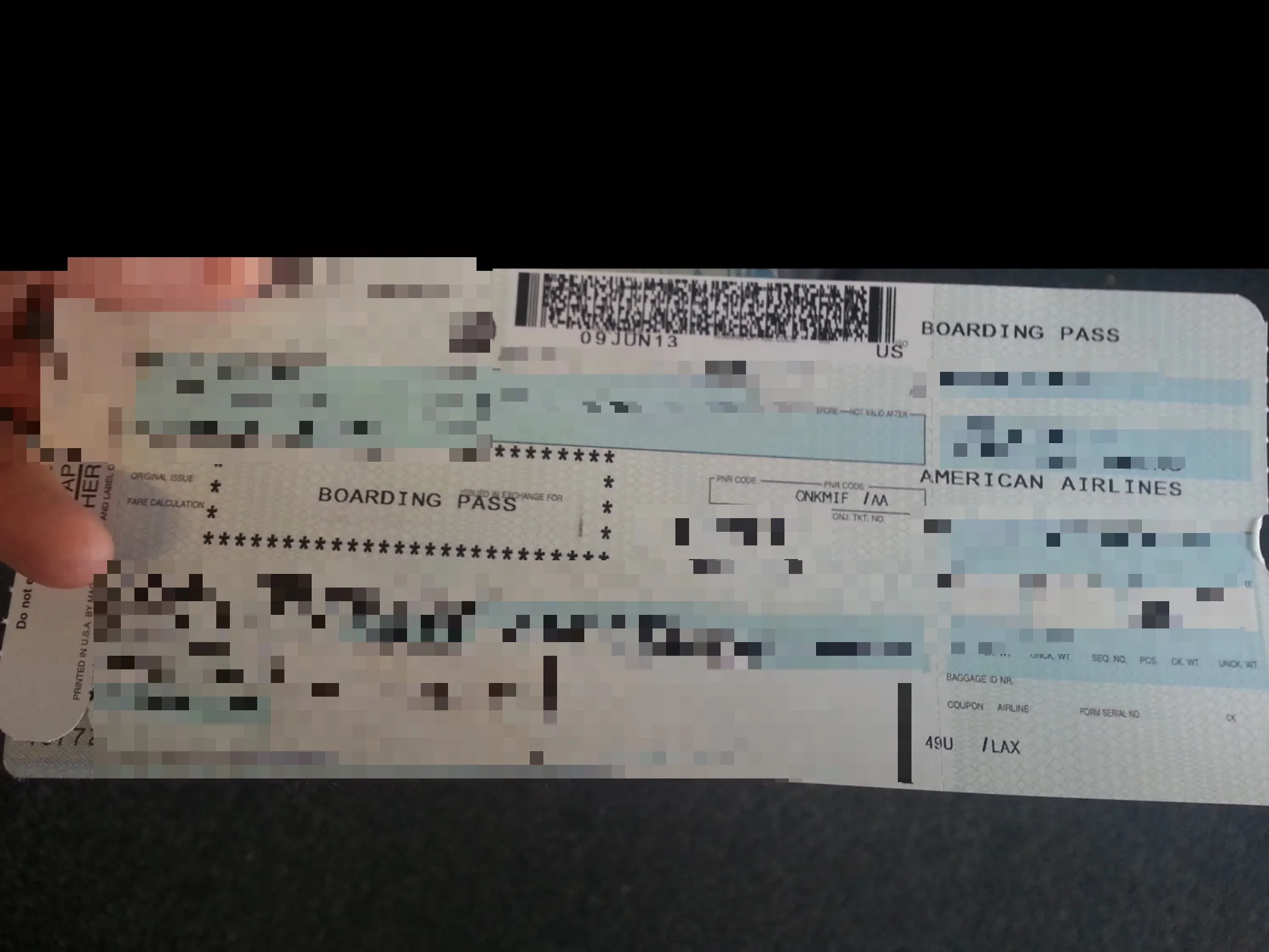 Censored boarding pass ticket, pixelated and censored