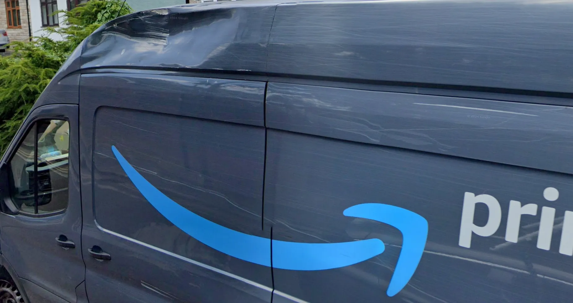 The challenge image, the entire starting material: a Street View screenshot of a dented Prime van parked outside a suburban British house — no EXIF, no readable plates, no signage