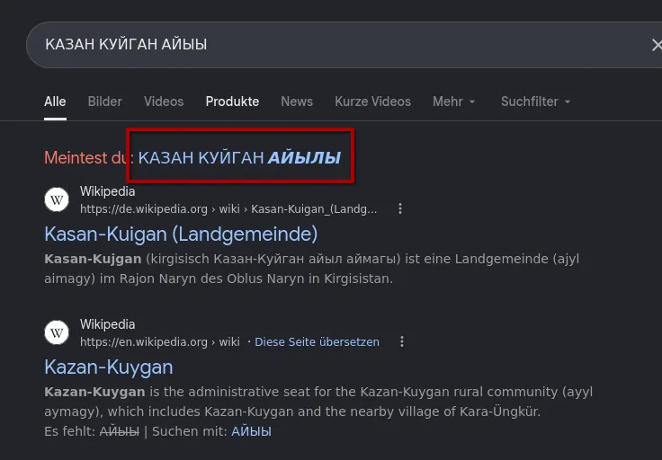 Google results for КАЗАН КУЙГАН АЙЫЫ: a red box around the suggestion Meintest du: КАЗАН КУЙГАН АЙЫЛЫ, below it Wikipedia results for Kasan-Kuigan (Landgemeinde) in the Naryn district of Kyrgyzstan and Kazan-Kuygan, the administrative seat of the Kazan-Kuygan rural community