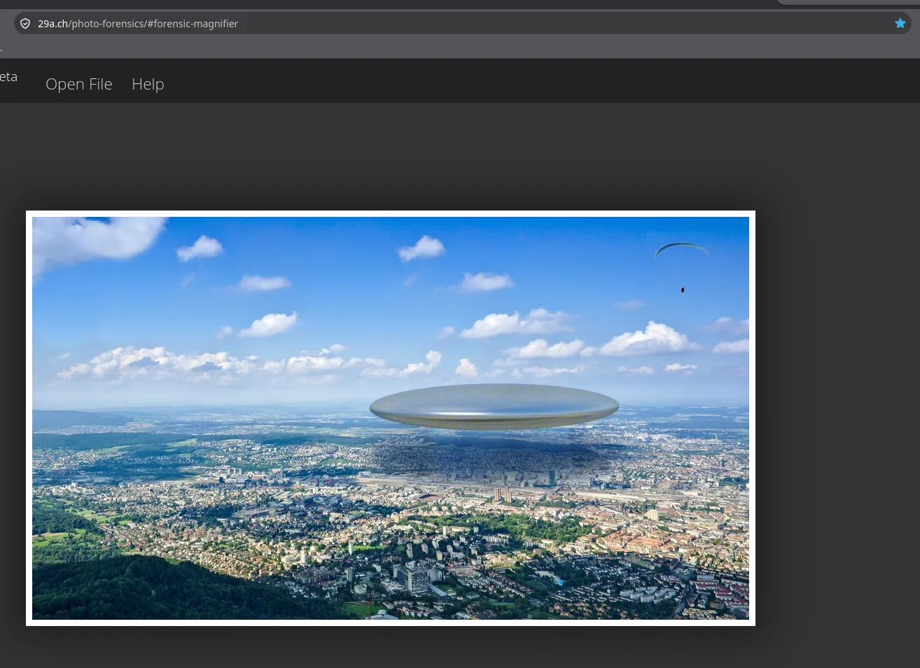 Forensically at 29a.ch/photo-forensics with its own sample image loaded, an aerial view of a city with a pasted-in flying saucer, and the Open File menu at the top