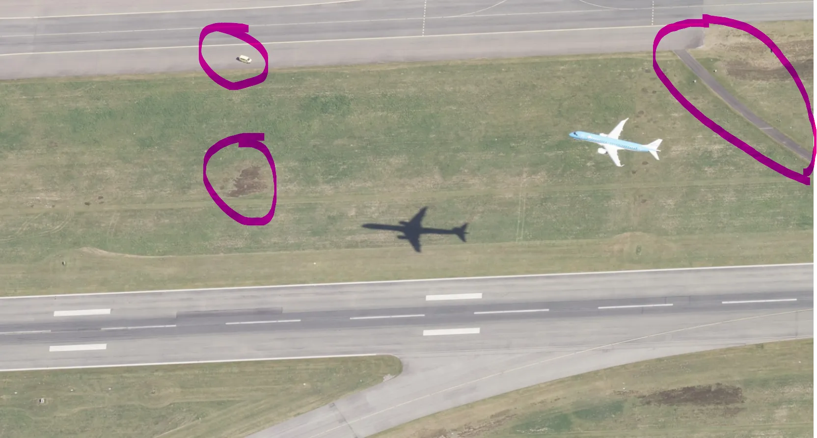 Challenge image with three features circled: a vehicle on the taxiway, a bare patch in the grass, and a dirt track at the top right