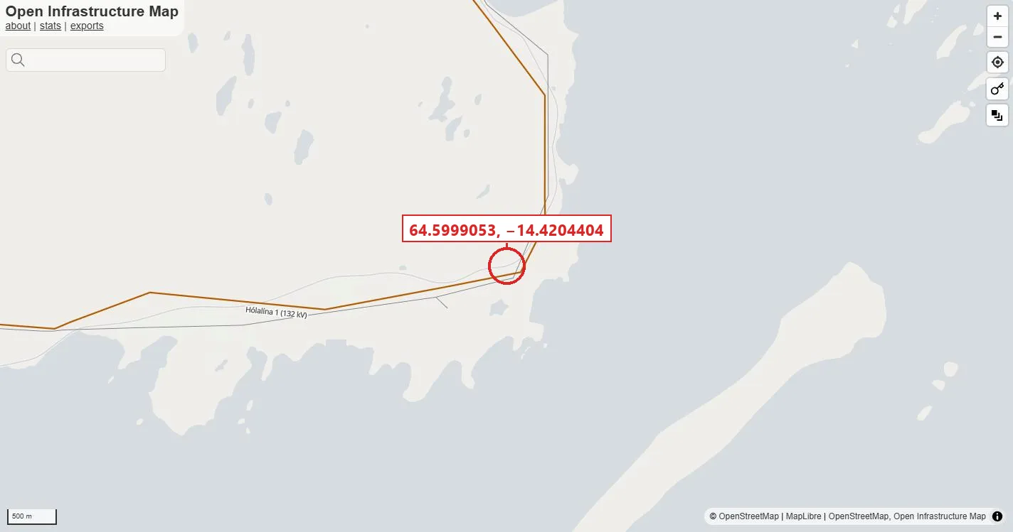 Open Infrastructure Map at the northern shore of Berufjörður: the 132 kV Hólalína 1 drawn in orange along the coast, the 66 kV network absent from this frame, and a red circle on the line where it runs between the road and the water