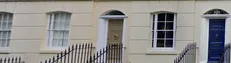 A Plonk It-style reference strip of UK terraced housing frontages used to distinguish regional building stone and render