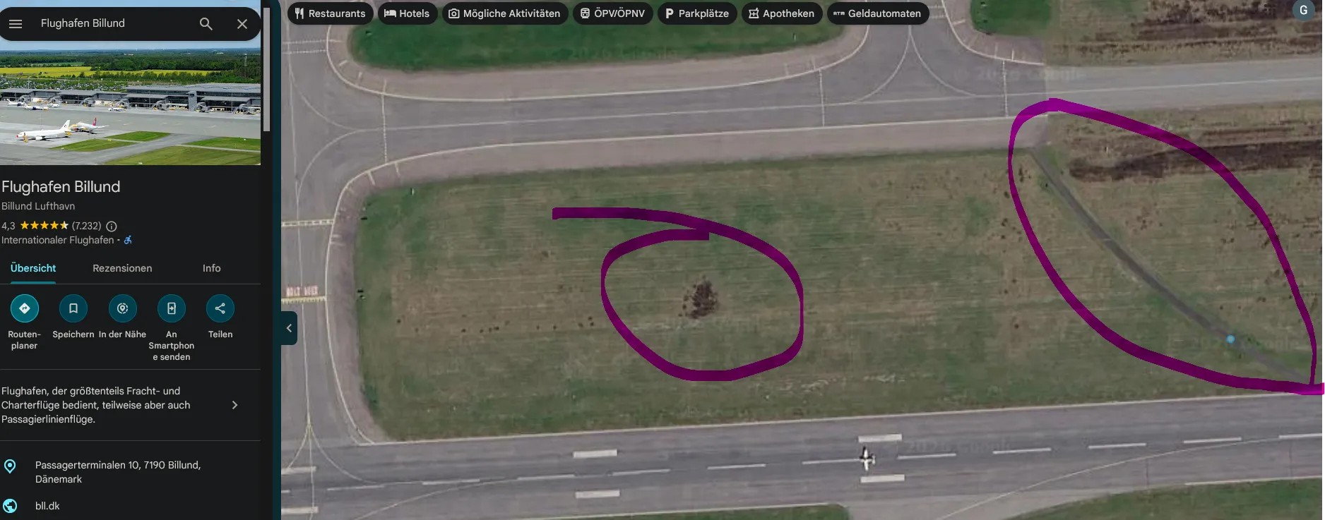 Google Maps satellite view of Billund with the matching bare patch and dirt track circled