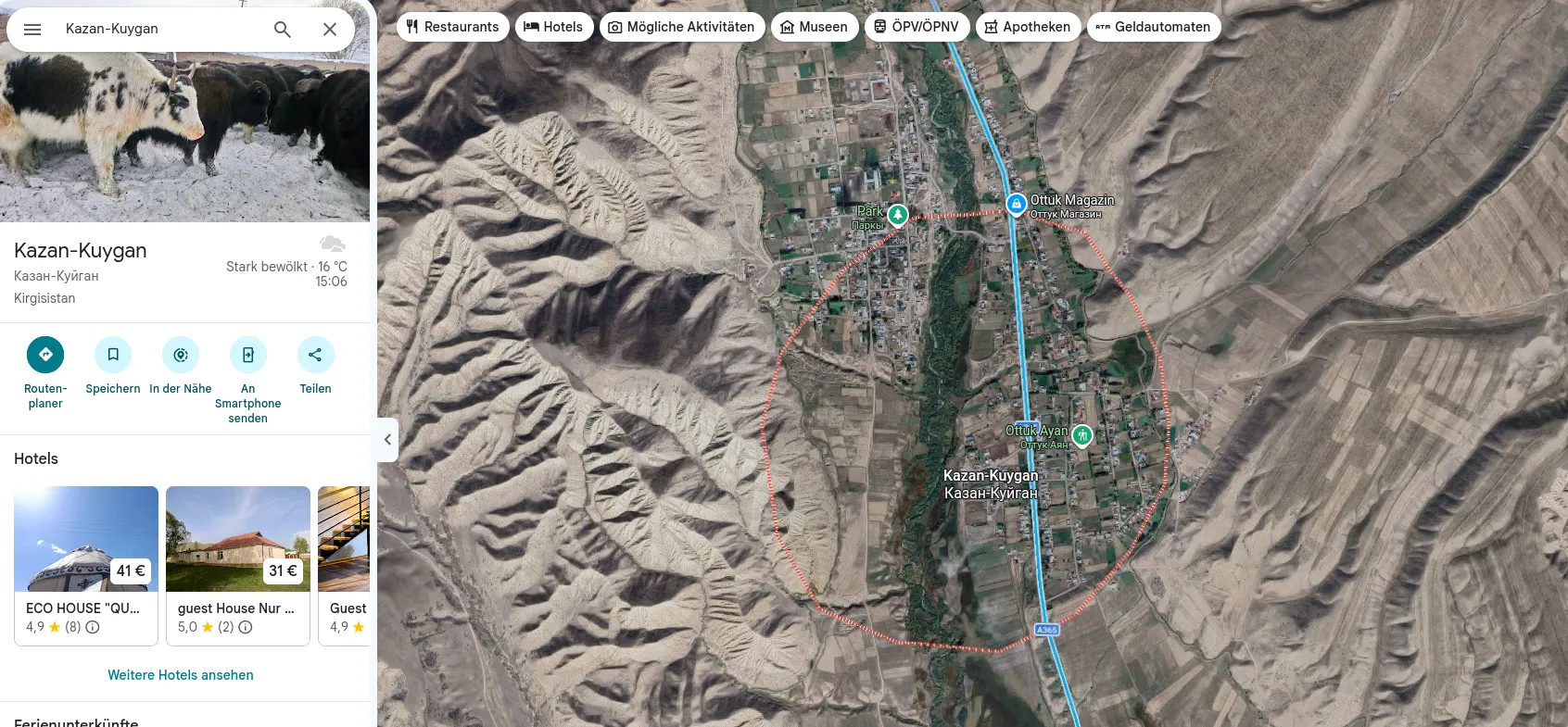 Google Maps satellite view of Kazan-Kuygan: a long village along a river valley between eroded ridges, the A365 running north to south along its eastern edge, with a red dotted outline around the village